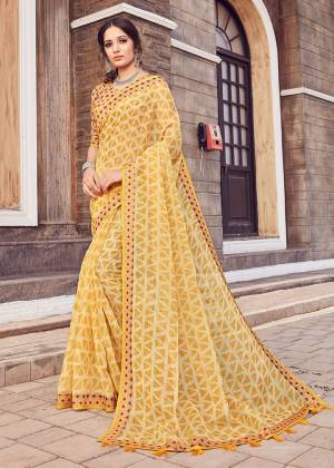 Here Is A Pretty Printed Saree In Yellow Color. This Saree Is Fabricated On Cotton Silk Paired With Art Silk Fabricated Blouse. It Is Light In Weight And Easy To Carry All Day Long. 