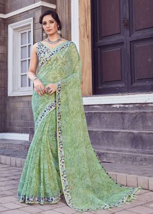Here Is A Pretty Printed Saree In Light Green Color. This Saree Is Fabricated On Cotton Silk Paired With Art Silk Fabricated Blouse. It Is Light In Weight And Easy To Carry All Day Long. 