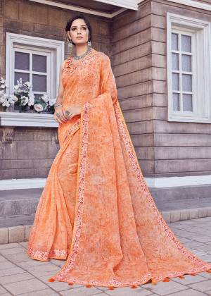 Grab This Beautiful Designer Saree In Orange Color. This Pretty Printed Saree Is Cotton Silk Based Paired With Art Silk Fabricated Blouse. Buy Now.