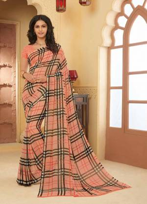 Here Is A Pretty Saree For Your Casual Or Semi-Casual Wear. This Printed Saree And Blouse Are Fabricated On Georgette WhichIs Light Weight, Durable And Easy To Carry All Day Long. Buy Now.