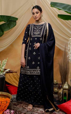 Grab Thi Pretty Designer Straight Suit In Pine Navy Blue Color. This Beautiful Detailed Embroidered Suit Is Chinon Based Which Is Light In Weight And Easy To Carry All Day Long. 