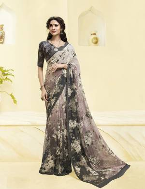 Here Is A Pretty Saree For Your Casual Or Semi-Casual Wear. This Printed Saree And Blouse Are Fabricated On Georgette WhichIs Light Weight, Durable And Easy To Carry All Day Long. Buy Now.