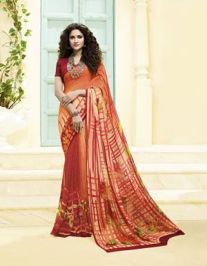 Add This Lovely Saree To Your Wardrobe Fabricated On Georgette. It Is Beautified With Prints All Over Gives A Pretty Simple and Elegant Look To Your Personality. 