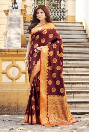 Flaunt Your Rich And Elegant Taste Wearing This Designer Silk Based Saree In Maroon Color Paired With Golden Colored Blouse. This Saree And Blouse Are Fabricated On Banarasi Art Silk Beautified With Weave. Buy Now.