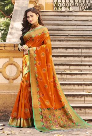 Flaunt Your Rich And Elegant Taste Wearing This Designer Silk Based Saree In Orange Color Paired With Golden Colored Blouse. This Saree And Blouse Are Fabricated On Banarasi Art Silk Beautified With Weave. Buy Now.