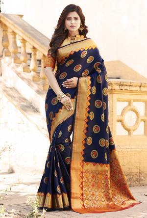 Flaunt Your Rich And Elegant Taste Wearing This Designer Silk Based Saree In Navy Blue Color Paired With Golden Colored Blouse. This Saree And Blouse Are Fabricated On Banarasi Art Silk Beautified With Weave. Buy Now.