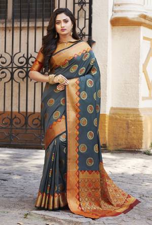 Flaunt Your Rich And Elegant Taste Wearing This Designer Silk Based Saree In Dark Grey Color Paired With Golden Colored Blouse. This Saree And Blouse Are Fabricated On Banarasi Art Silk Beautified With Weave. Buy Now.