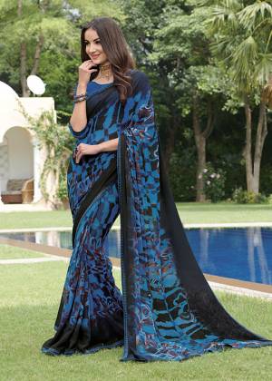 Grab This Pretty Georgette Based Saree For Your Semi-Casual Wear Which Is Light In Weight And Beautified With Prints. 