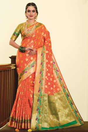For A Proper Traditional Look, Grab This Designer Silk Based Saree In Orange Color Paired With Contrasting Green Colored Blouse. This Saree And Blouse Are Fabricated On Art Silk Beautified With Weave. 