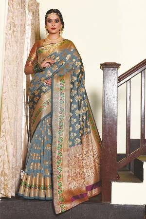 Enhance Your Personality Wearing This Pretty Designer Saree In Grey Color Paired With Contrasting Purple Colored Blouse. This Saree And Blouse Are Fabricated On Art Silk Beautified With Weave. Buy Now.
