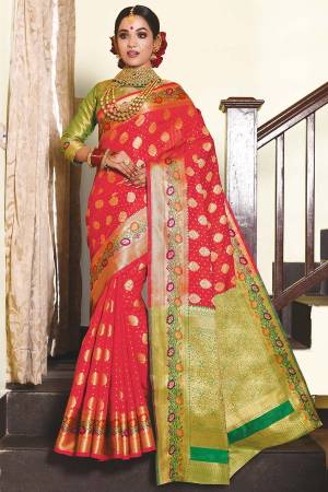 Enhance Your Personality Wearing This Pretty Designer Saree In Red Color Paired With Contrasting Green Colored Blouse. This Saree And Blouse Are Fabricated On Art Silk Beautified With Weave. Buy Now.