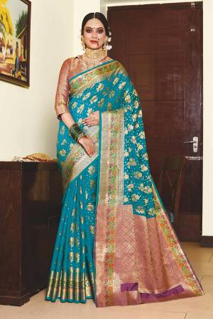 For A Proper Traditional Look, Grab This Designer Silk Based Saree In Blue Color Paired With Contrasting Purple Colored Blouse. This Saree And Blouse Are Fabricated On Art Silk Beautified With Weave. 