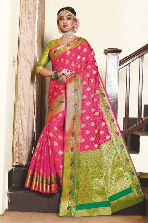 Enhance Your Personality Wearing This Pretty Designer Saree In Rani Pink Color Paired With Contrasting Green Colored Blouse. This Saree And Blouse Are Fabricated On Art Silk Beautified With Weave. Buy Now.