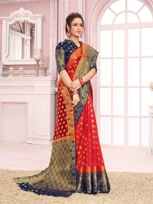 For A Proper Traditional Look, Grab This Designer Saree In Red Color Paired With Navy Blue Colored Blouse. This Saree Is Fabricated On Nylon Crepe Silk Paired With Art Silk Fabricated Blouse. 