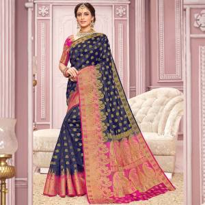 Here Is Rich And Elegant Looking Saree In Navy Blue Color Paired With Rani Pink Colored blouse. This Saree Is Nylon Crepe Silk Based Paired With Art Silk Fabricated Blouse. 
