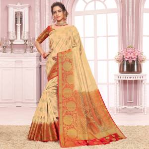 For A Proper Traditional Look, Grab This Designer Saree In Cream Color Paired With Red Colored Blouse. This Saree Is Fabricated On Nylon Crepe Silk Paired With Art Silk Fabricated Blouse. 