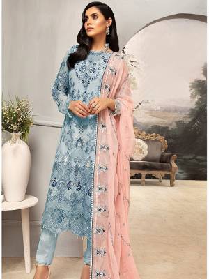 Here Is A Very Pretty Designer Straight Suit In Sky Blue Color Paired with Contrasting Pastek Peach Colored Dupatta. Its Heavy Embroidered Top And Dupatta Are Georgette Based Paired With Santoon Fabricated Bottom. Buy This Party Wear Suit Now.
