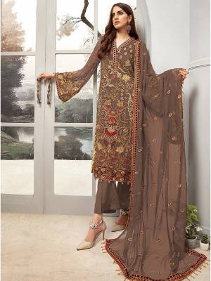 Here Is A Very Pretty Designer Straight Suit In Light Brown Color. Its Heavy Embroidered Top And Dupatta Are Georgette Based Paired With Santoon Fabricated Bottom. Buy This Party Wear Suit Now.