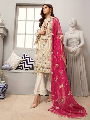 Here Is A Very Pretty Designer Straight Suit In Off-White Color Paired with Contrasting Dark Pink Colored Dupatta. Its Heavy Embroidered Top And Dupatta Are Georgette Based Paired With Santoon Fabricated Bottom. Buy This Party Wear Suit Now.