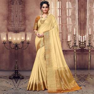 Simple And Elegant Looking Silk Based Saree Is Here In Cream Color. This Pretty Saree And Blouse Are Fabricated On Art Silk Beautified With Weaved Border. Buy Now.