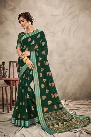 Add This Beautiful Designer Saree To Your Wardrobe In Dark Green Color. This Saree And Blouse Are Chanderi Based Beautified With Resham And Jari Work. 
