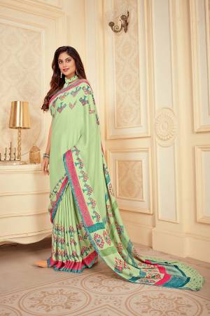 Flaunt Your Rich And Elegant Taste Wearing This Pretty Light Green colored Saree. This Saree And Blouse Are Satin Silk Based Beautified With Prints. Buy This Saree Now.