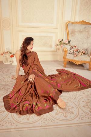 Simple and Elegant Looking Saree Is Here In Brown Color Paired With Contrasting Yellow Colored Blouse. This Saree And Blouse Are Fabricated On Satin Silk Beautified With Prints. It Is Light Weight , Soft Towards Skin and Easy To Carry All Day long. 