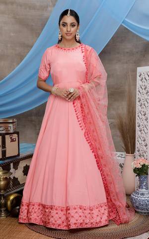 Look Pretty In This Designer Floor Length Suit In Pink Color. Its Lovely Floor Length Top Is Silk Based Paired With Net Fabricated Dupatta. Buy Now.