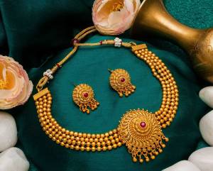 Give An Enhanced Look To Your Personality By Pairing Up This Beautiful Necklace Set With Your Ethnic Attire. This Pretty Set Is In Golden Color Beautified With Stone Work. Buy Now.