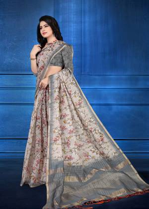 You Will Definitely Earn Lots Of Compliments Wearing This Designer Saree In Grey Color. This Saree And Blouse Are Cotton Silk Based Beautified With Jari Checks And Prints. It Is Light In Weight And Easy To Carry All Day Long. 