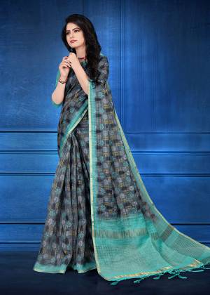 You Will Definitely Earn Lots Of Compliments Wearing This Designer Saree In Dark Grey Color. This Saree And Blouse Are Cotton Silk Based Beautified With Jari Checks And Prints. It Is Light In Weight And Easy To Carry All Day Long. 