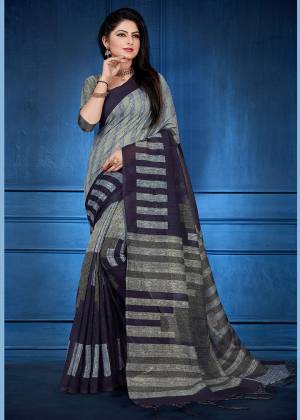Add This Beautiful saree To Your Wardrobe In Grey Color Fabricated On Handloom Silk. This Saree And Blouse Are Beautified With Prints And Easy To Carry All Day Long.