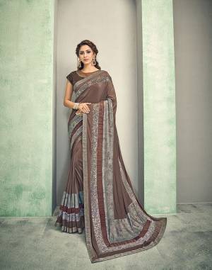 A very earthy-hued yet adorned with perfect sheen , this brown hued saree when paired with statement jewels will make you look like a diva. Drape it in a free-falling pallu style to get the most of the look. 