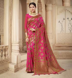 Shine Bright Wearing This Rich Silk Based Designer Saree In Rani Pink Color. This Saree Is Fabricated On Banarasi Silk Paired With Art Silk Fabricated Blouse. It Is Beautified With Heavy Detailed Weaved Giving An Attractive Look .