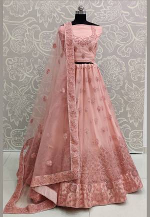 You Will Definitely Earn Lots Of Compliments Wearing This Designer Trendy Lehenga Choli In Pink Color. Its Blouse, Lehenga And Dupatta Are Fabricated On Net Beautified With Tone To Tone Embroidery Giving A Rich Subtle Look. Buy This Lovely Piece Now.