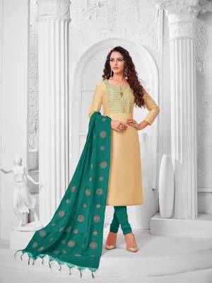 Add This Pretty Suit To Your Wardrobe In Cream colored Top Paired With Contrasting Teal Green Colored Bottom and Dupatta. Its Top Is Fabricated On Modal Silk Paired With Cotton Bottom and Dupatta. 