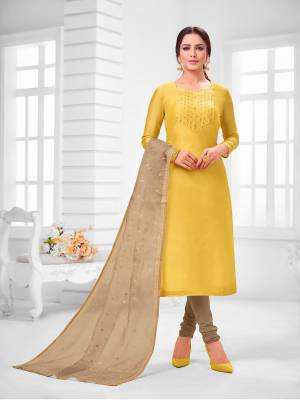 You Will Definitely Earn Lots Of Compliments Wearing This Designer Straight Suit In Yellow Colored Top Paired With Beige Colored Bottom And Dupatta. Its Top Is Modal Silk Based Paired With Cotton Bottom and Orgenza Fabricated Dupatta. 