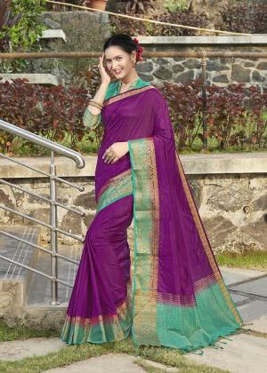 Celebrate This Festive Season With Beauty And Comfort Wearing This Pretty Saree In Purple Color Paired With Sea Green Colored Blouse. This Plain Saree Is Fabricated On Banarasi Silk With Broad Weaved Border Paired With Art Silk Fabricated Blouse. 