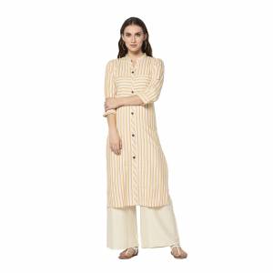 Add This Pretty Kurti To Your Wardrobe In Off-White Color. This Readymade Kurti Is Fabricated On Cotton With Lining Prints. It Is Light In Weight And Easy To Carry All Day Long .