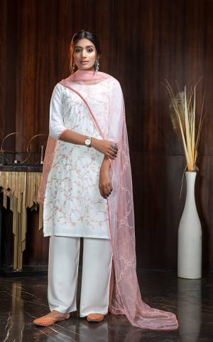 Flaunt Your Rich And Elegant Taste Wearing This Designer Suit In White Color Paired With Baby pink Colored Dupatta. Its Top Is Georgette Based Paired With Rayon Bottom and Net Fabricated Dupatta. Buy Now.