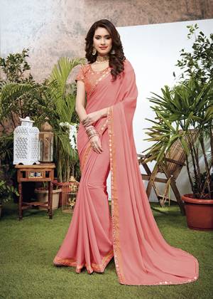 Look Pretty Wearing This Elegant Looking Designer Saree In Pink Color. This Pretty Saree Is Fabricated On Georgette Paired With Art Silk Fabricated Blouse. It Is Light In Weight And Easy To Carry All Day Long. 
