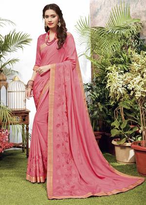 Celebrate This Festive Season With Beauty And Comfort Wearing This Designer Embroidered Saree In Pink Color. This Saree Is Fabricated On Chiffon Paired With Art Silk Fabricated Blouse. 