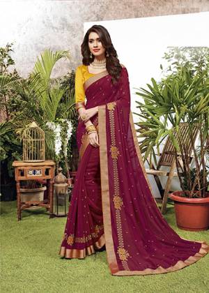Look Pretty Wearing This Elegant Looking Designer Saree In Magenta Pink Color. This Pretty Saree Is Fabricated On Georgette Paired With Art Silk Fabricated Blouse. It Is Light In Weight And Easy To Carry All Day Long. 