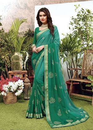 Celebrate This Festive Season With Beauty And Comfort Wearing This Designer Embroidered Saree In Sea Green Color. This Saree Is Fabricated On Chiffon Paired With Art Silk Fabricated Blouse. 