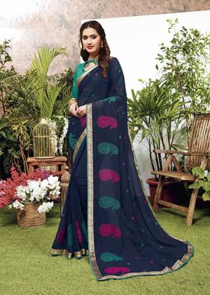 Look Pretty Wearing This Elegant Looking Designer Saree In Navy Blue Color. This Pretty Saree Is Fabricated On Georgette Paired With Art Silk Fabricated Blouse. It Is Light In Weight And Easy To Carry All Day Long. 