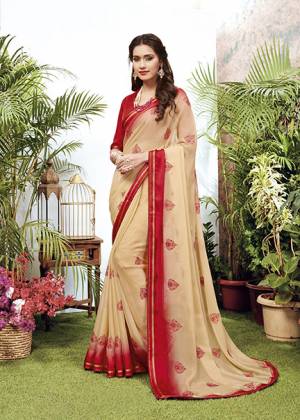 Celebrate This Festive Season With Beauty And Comfort Wearing This Designer Embroidered Saree In Cream Color. This Saree Is Fabricated On Chiffon Paired With Art Silk Fabricated Blouse. 