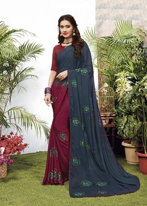 Look Pretty Wearing This Elegant Looking Designer Saree In Navy Blue And Maroon Color. This Pretty Saree Is Fabricated On Georgette Paired With Art Silk Fabricated Blouse. It Is Light In Weight And Easy To Carry All Day Long. 