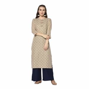 Add This Pretty Kurti To Your Wardrobe In Beige Color. This Readymade Kurti Is Fabricated On Cotton With Prints. It Is Light In Weight And Easy To Carry All Day Long .