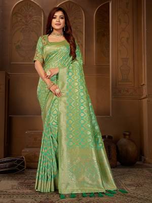 Celebrate This Festive Wearing This Designer Saree In Light Green Color Paired With Light Green Colored Blouse. This Saree Is Fabricated On Jacquard Silk Paired With Art Silk Fabricated Blouse. Its Saree Is Beautified With Weave Paired With Embroidered Blouse. 