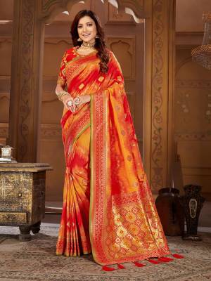 Shine Bright Wearing This Designer Saree In Red And Orange Color Paired With Red Colored Blouse. This Pretty Weaved Saree Is Fabricated On Jacquard Silk Paired With Art Silk Fabricated Embroidered Blouse. 